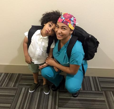 Female anesthesiologist assistant with her child