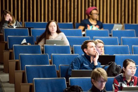 Seven school of medicine students sitting in auditorium
