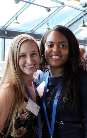 Two female certified anesthesiologist assistant program graduates at event