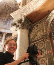 Image of Elizabeth Bolman with camera in church