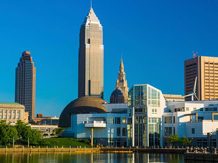 A picture of downtown Cleveland with Lake Erie in front