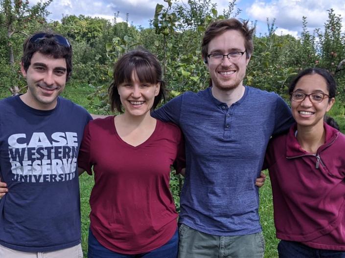 Four CWRU MSTP student smile for a picture outside 