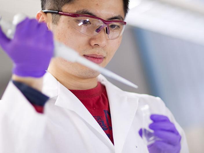 Male researcher working with a tool for cell therapy.