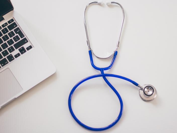 Photo of stethoscope and laptop