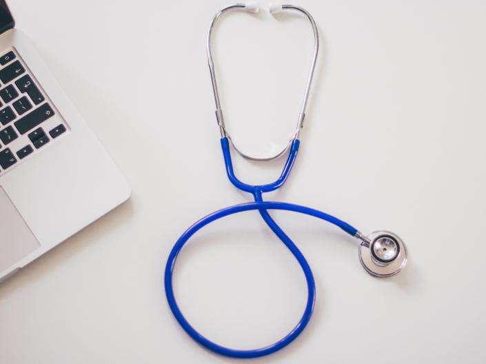 Photo of stethoscope and laptop