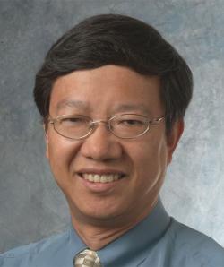 Image of Dr Lu with black hair and glasses
