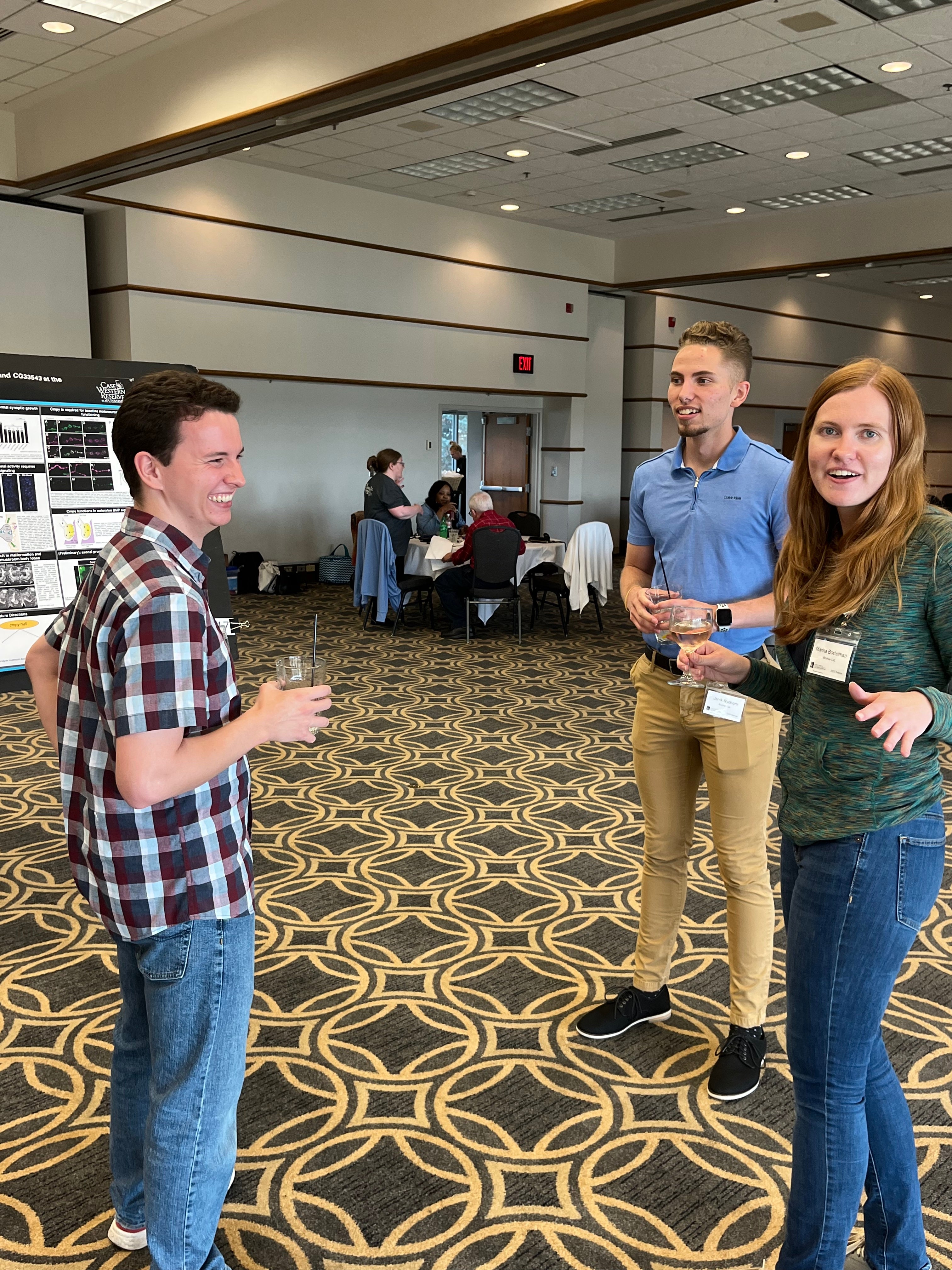 People laughing during a scientific conversation