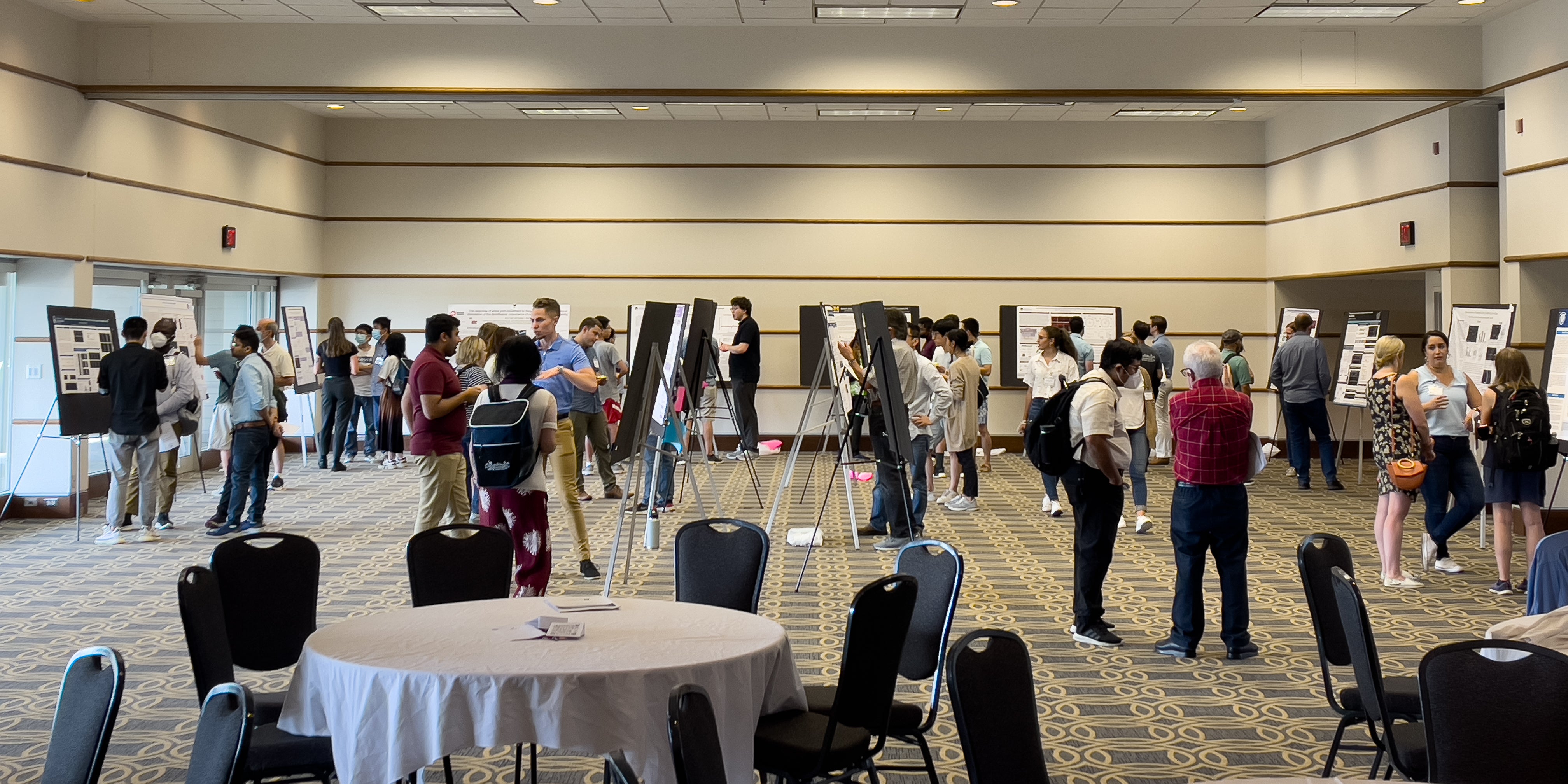 Researchers presenting their work to others