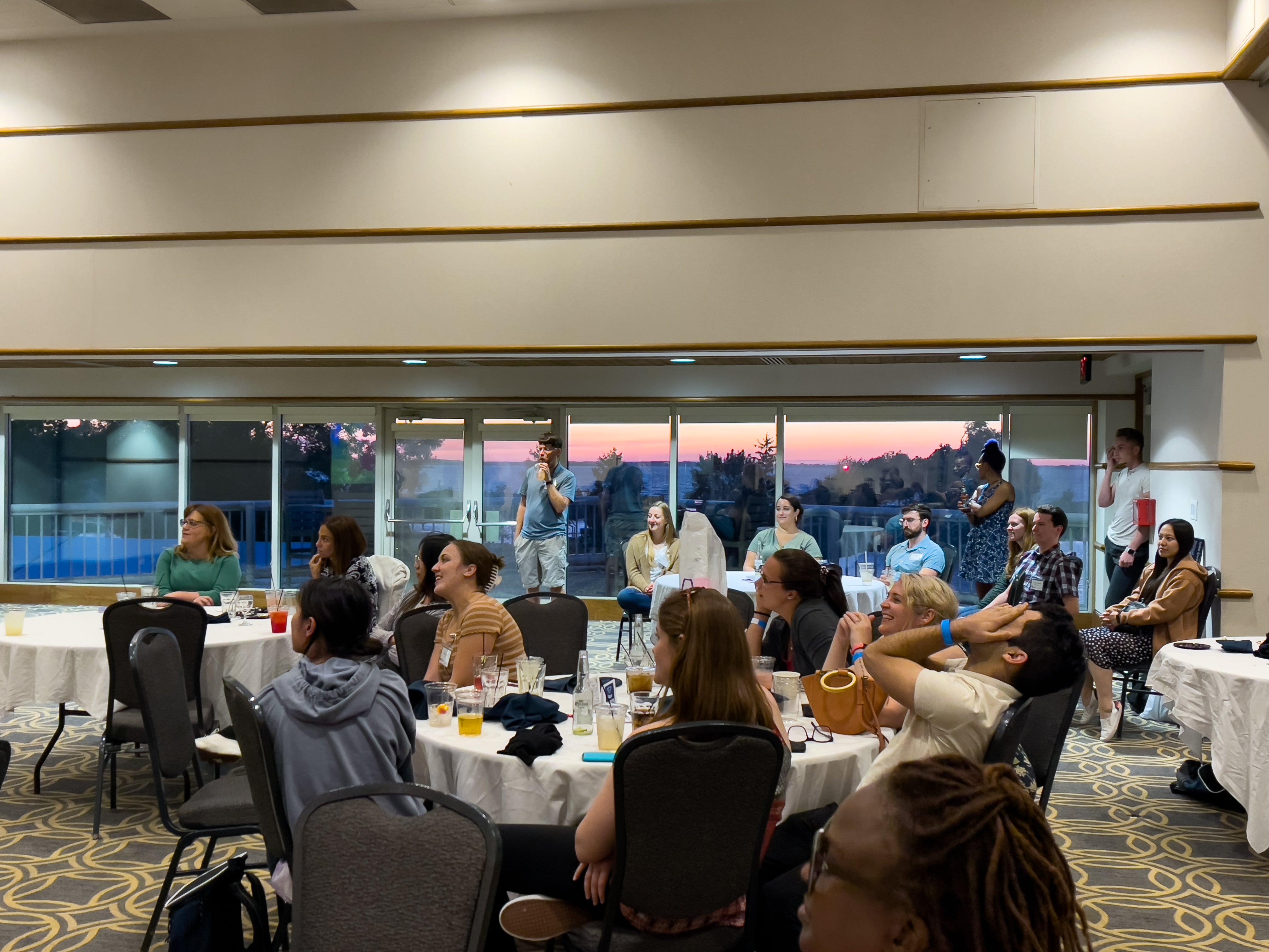 A group of people smiling during a conference