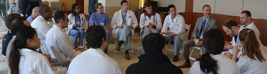 Circle of neurosurgeons speaking