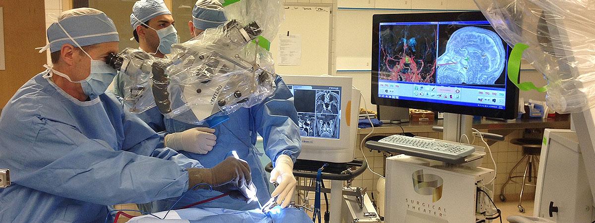 Neurosurgeons practicing with simulator