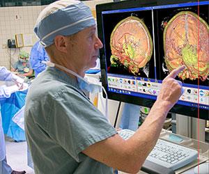 Neurosurgeon using surgical rehearsal simulator
