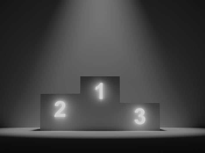 Black and white image of a winner's podium with places for first, second, and third.