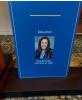 Blue placard with a small portrait of Hope Barkoukis in the Center that reads Education, Hope Barkoukis, PhD, RDN, LD, FAND
