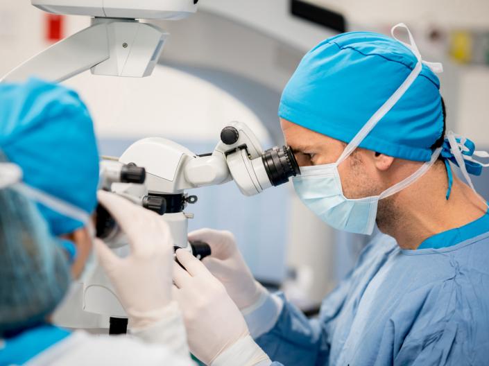 Eye surgeon performing research