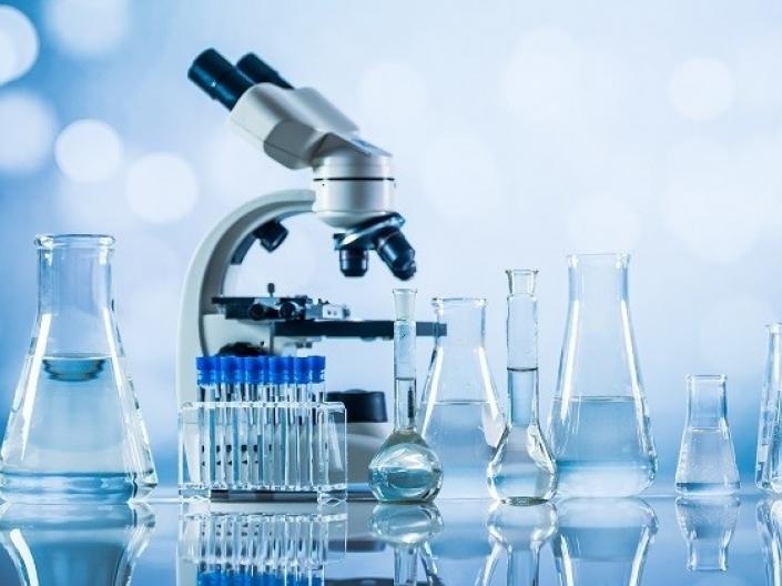 Image of microscope and beakers