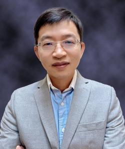 Picture of wenzhang wang in grey sports coat blue shirt 