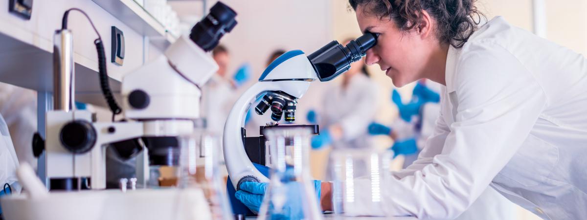student at microscope