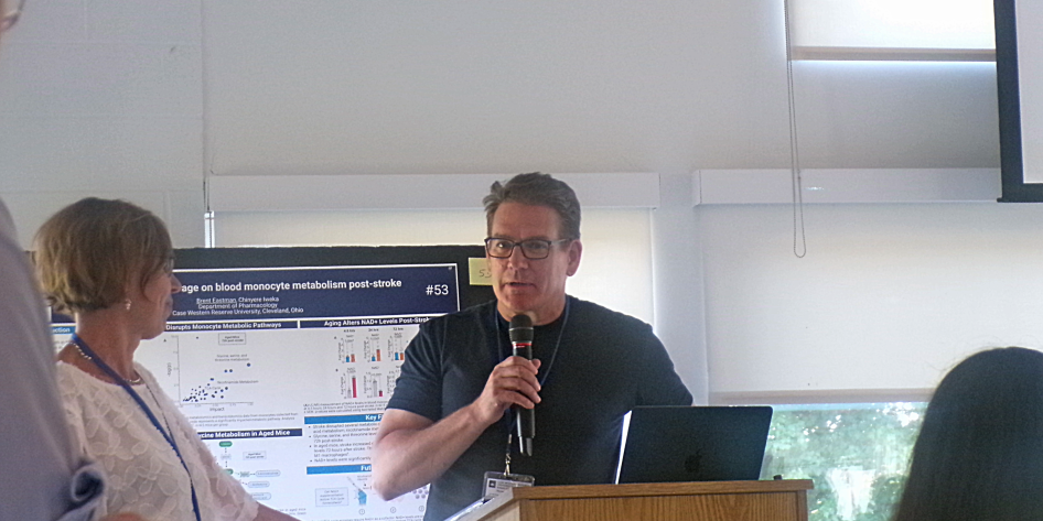 Professor presenting award to postdoc