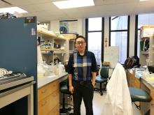 Lei Zhang in a lab room