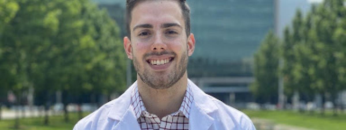 Michael Crookshanks in his whitecoat in front of hospital