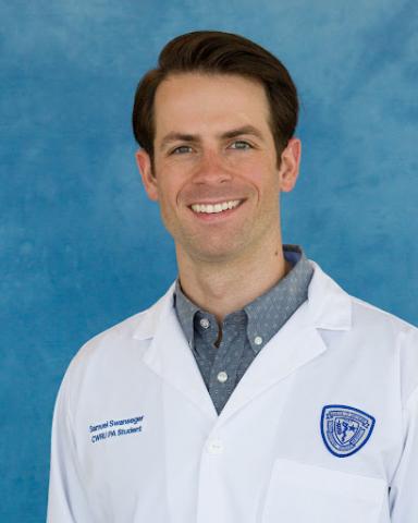 Samuel Swanseger in his whitecoat headshot in front of a blue background