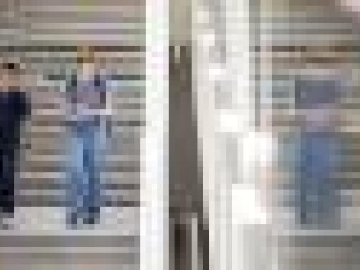Two healthcare professionals walking downstairs