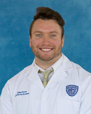 Elijah Rouse in his whitecoat headshot in front of a blue background