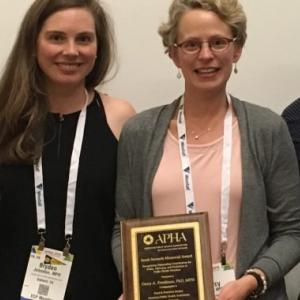 Doctor Darcy Freedman of Case Western Reserve holding the Sarah Samuels Memorial Award
