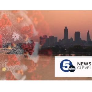 Composite image of Omicron and Cleveland skyline