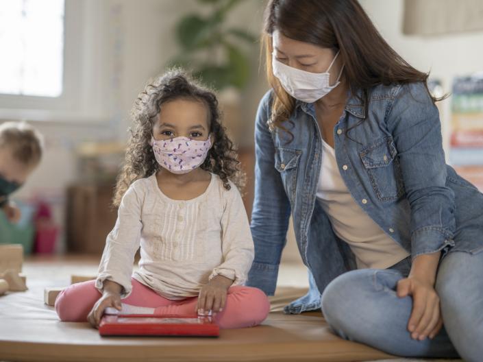 Child and adult with masks