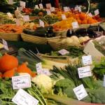 Farmers market stand full of vegetables
