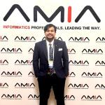 Krishna Mridha with AMIA backdrop