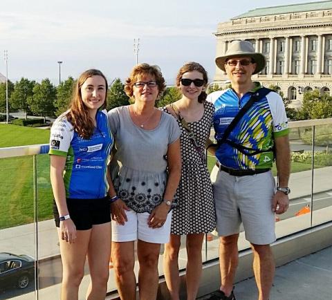 A family posing together after the bike race. 