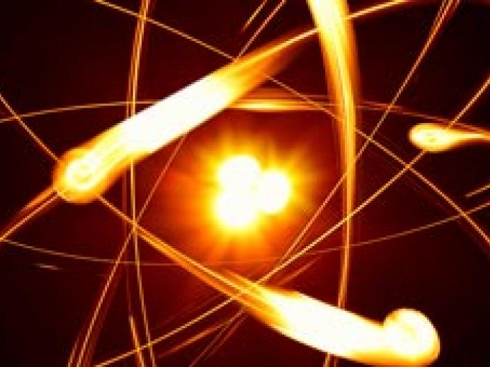 An atom made up of moving fire like balls