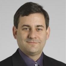 Headshot of Gordon McLennan, MD with grey background