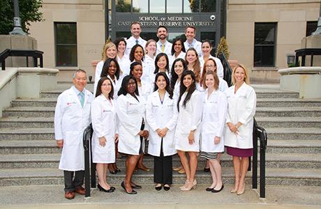 Image of doctors in front of School of Medicine.