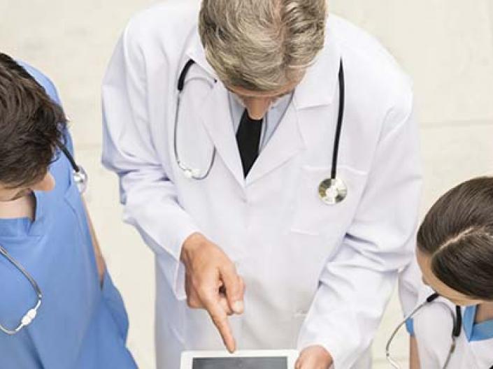 Three doctors discussing a case.