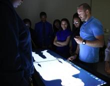 Bryan Singelyn, instructor for the Case Western Reserve University School of Medicine Department of Anatomy, walks CSSM students through the human anatomy using Anatomage technology.