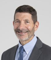 J. Harry Isaacson wearing a jacket and tie