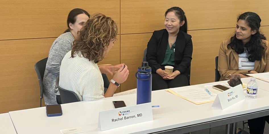 group of women speaking at table