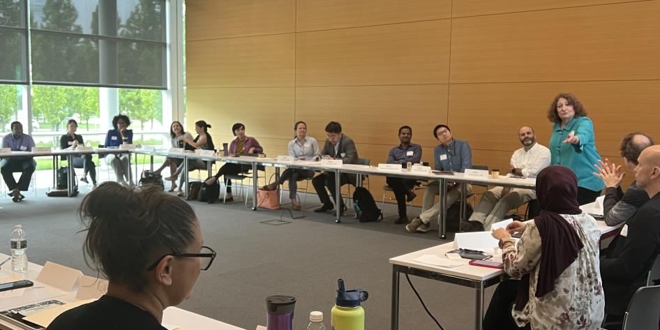 panel at front of room of people