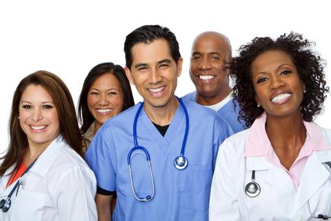 Five health professionals smiling