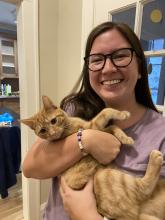 Mia Wang holding her cat, Butter.