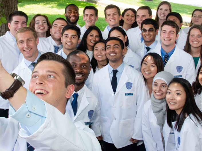 CWRU Medicine students take group selfie at the White Coat Ceremony