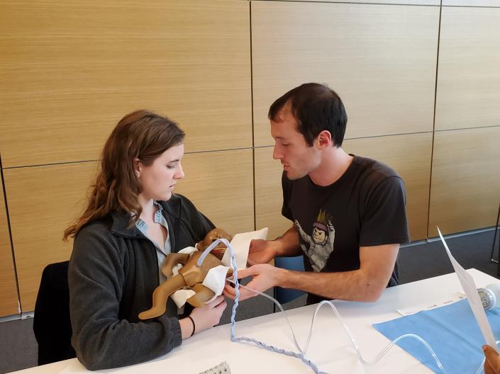 World Medicine Pathway students using a simulator as they learn to help infants