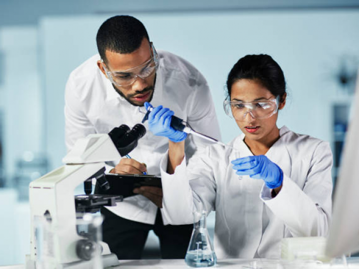 Two school of medicine students working in a lab