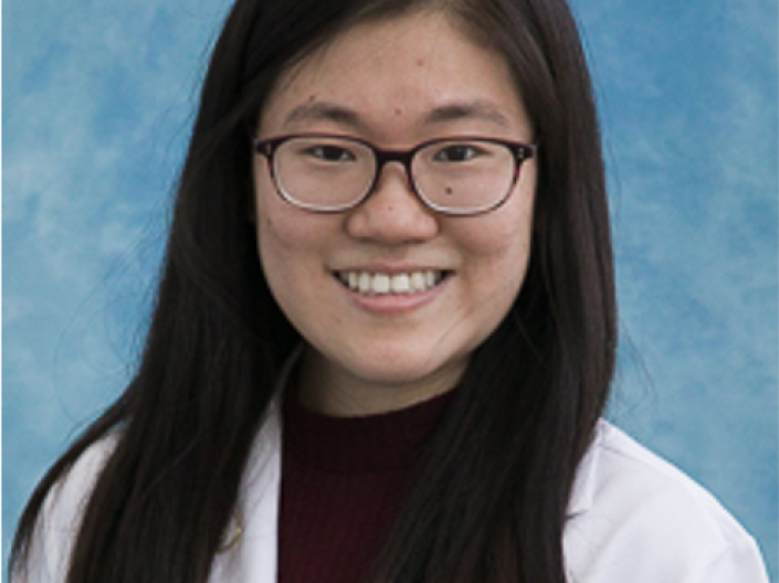 Photo of Yiran Wang wearing a white coat