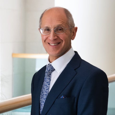Dean Gerson standing in front of a railing