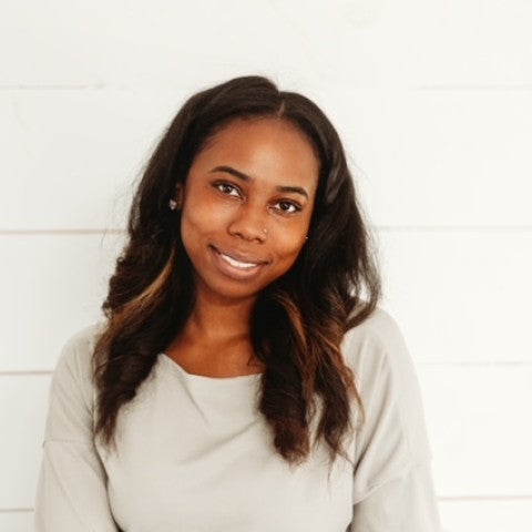 Pierra standing against a white background